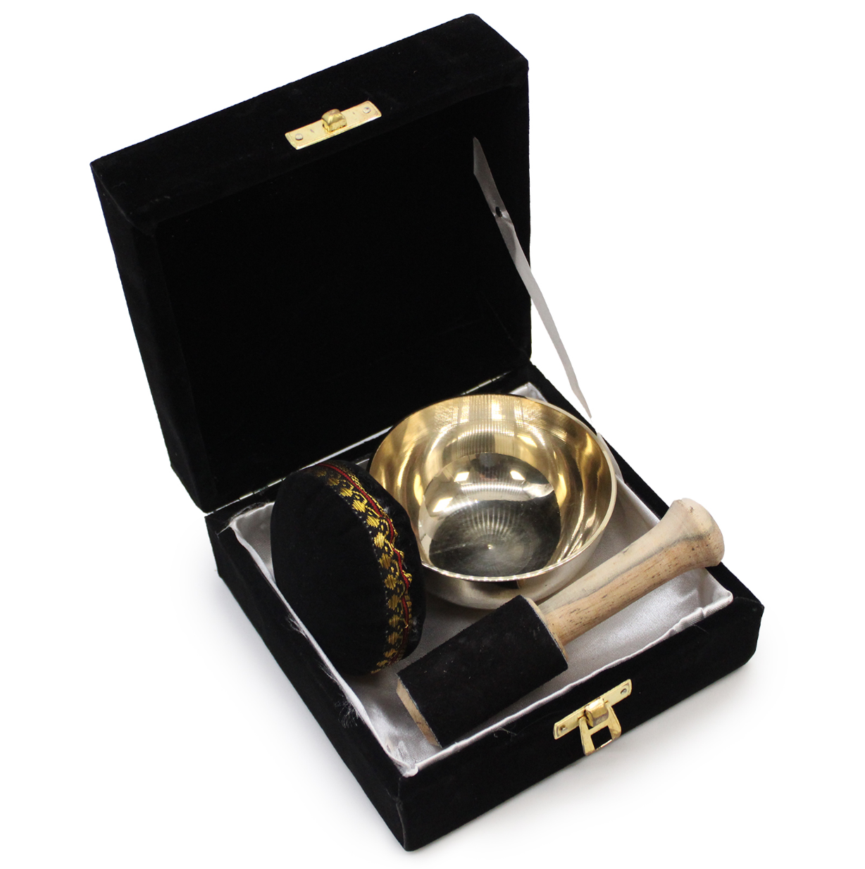 Brass Singing Bowl Set and black brush in a black velvet box on a white background
