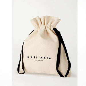 Kati Kaia branded beige drawstring pouch packaging for citrine crystal bracelet jewellery