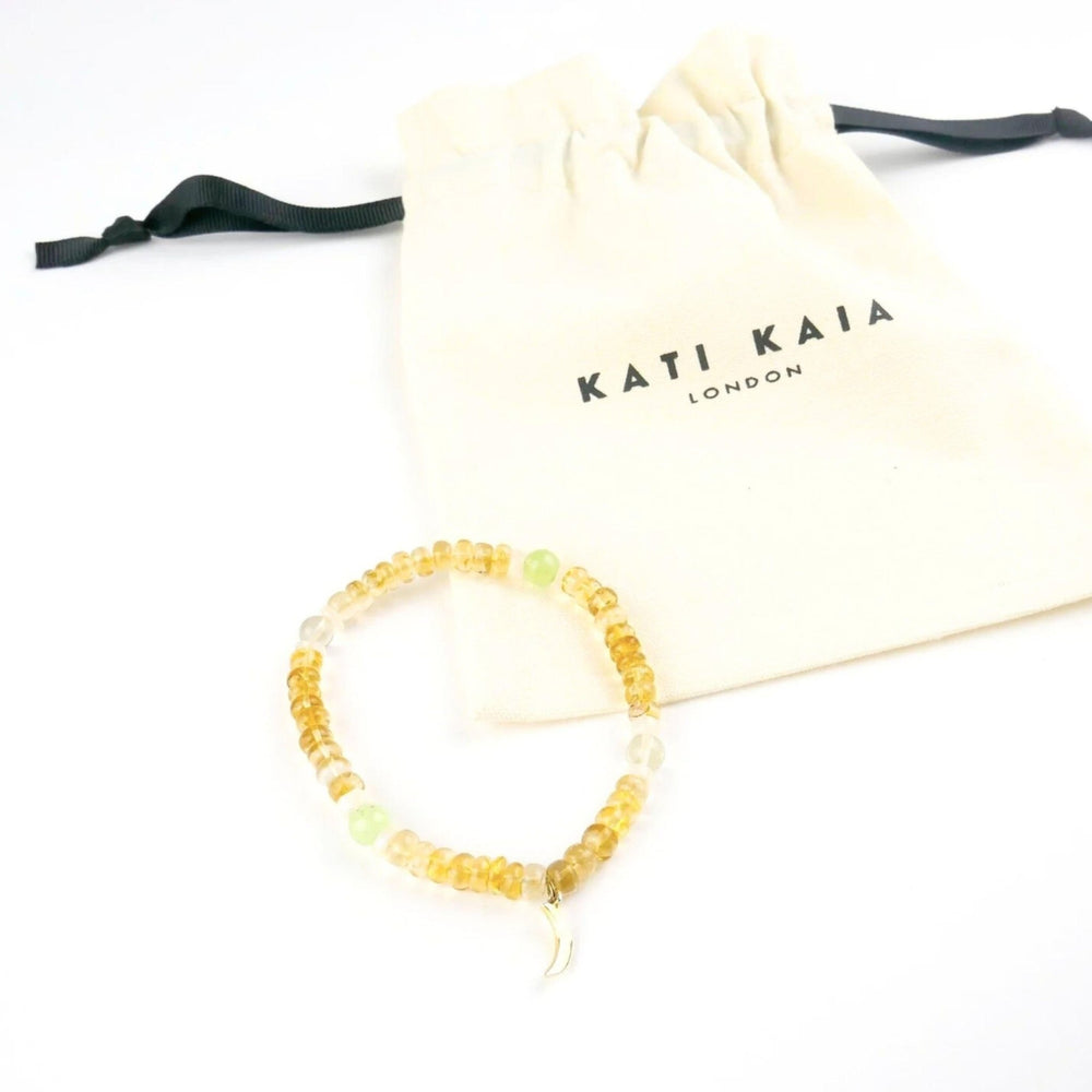Kati Kaia citrine crystal set for meditation with yellow beads and a white drawstring pouch