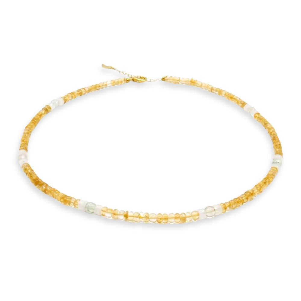Kati Kaia citrine crystal set for meditation necklace with yellow and clear beads on white background