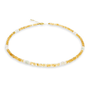 Kati Kaia citrine crystal set for meditation necklace with yellow and clear beads on white background