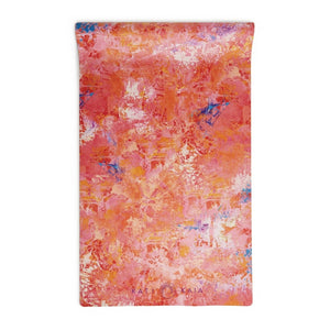 Kati Kaia stylish travel yoga mat UK with vibrant pink and orange abstract design