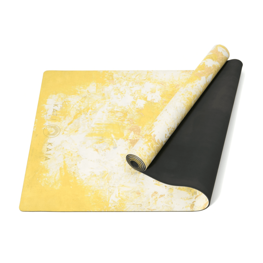 Kati Kaia yellow artist yoga mat with textured yellow and white design and black non-slip backing