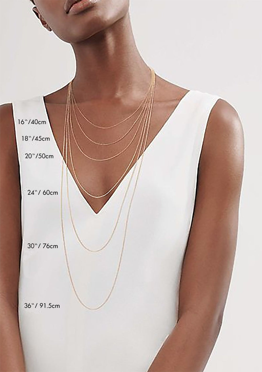 Kati Kaia layered gold necklaces showcasing crystal energy jewellery in various lengths on model