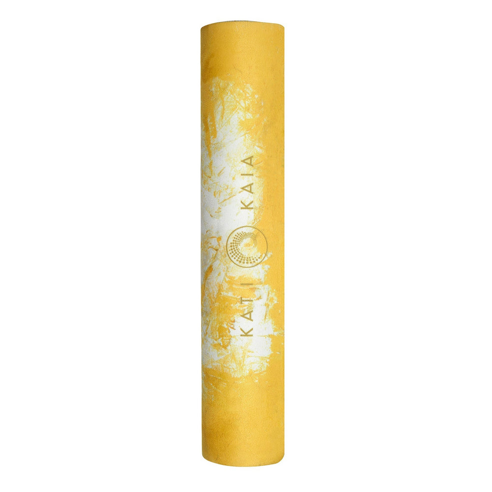 Kati Kaia yellow artist yoga mat rolled up with white floral design and brand logo