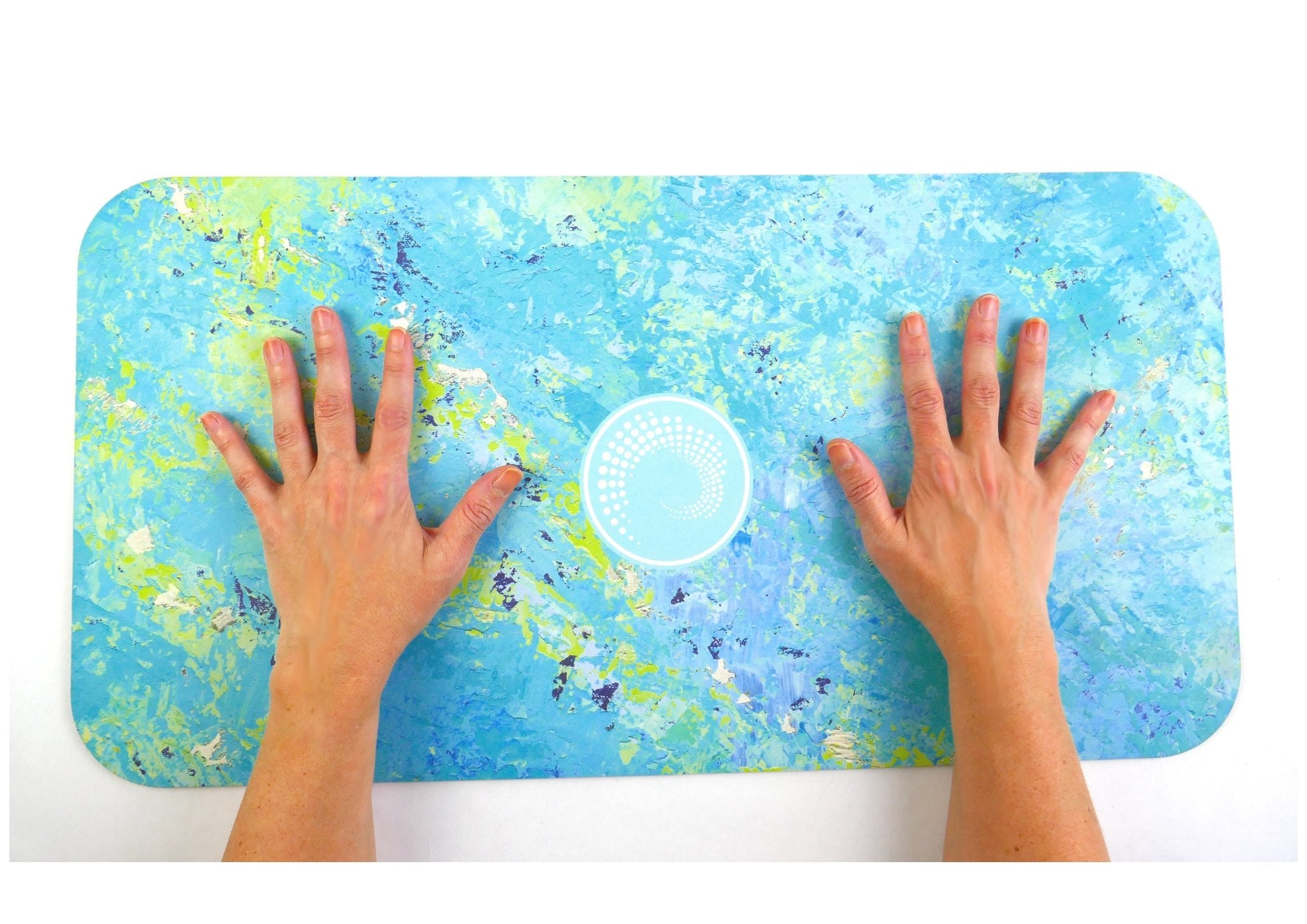 Thalassa yoga pad for travel with ocean-inspired blue and green design showing hands on mat